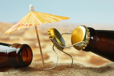 funny cork and bottle on a sandy beach