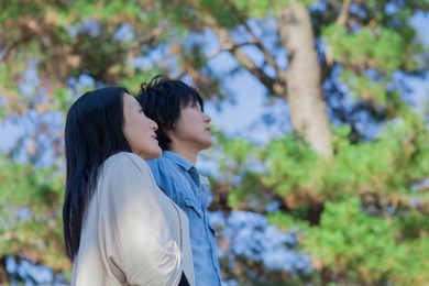 japanese couples stroll in the park