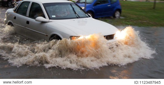 the vehicle passes through a flooded area, a flooded street.