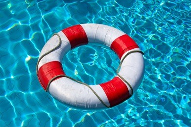 life buoy in blue swimming pool