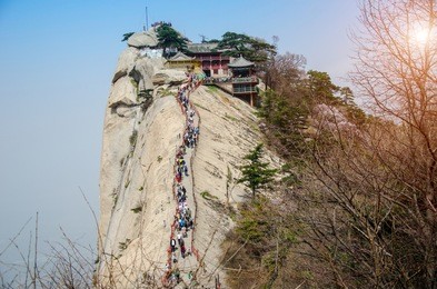 the pavilion of temple on top at huashan mountain with sunlight .route of ridge to peak valley of the most popular that tourists to travel destinations at shaanxi province,xi'an, china.