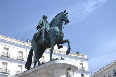 the monument of charles iii on puerta del sol in madrid, spain