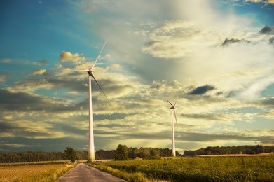 windmill at sunset with a cloudy sky