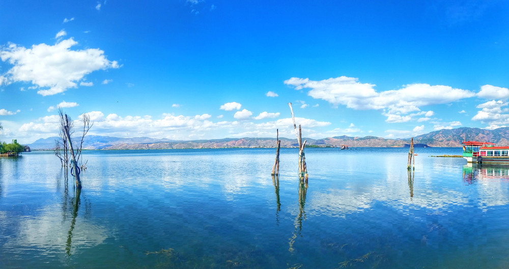 panorama scenery of erhai lake and mountain with blue clear sky in dali, yunnan province, china.