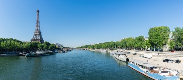 paris eiffel tower and river seine at summer in paris, france. eiffel tower is one of the most iconic landmarks of paris.
