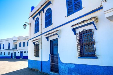 amazing view of the street in blue and white on a sunny day in the old city (medina) kasbah of the udayas in rabat, morocco, africa. unesco heritage site. rabat is the capital of morocco.