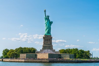 the statue of liberty  with blue sky background.