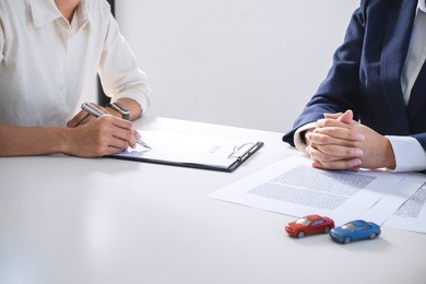 car and home for rent concept, broker agent presenting and consult to customer to decision making sign form agreement, home and car model.