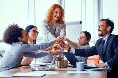 business solution ready. business team holding hands together. successful work is done. toned concept.