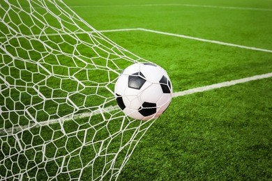 football in the goal net