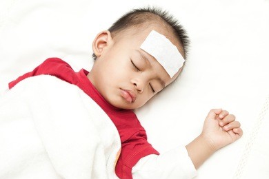 asian baby sleeping and suffering fever heat