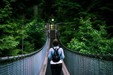 capilano suspension bridge with girl walking empty