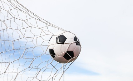 football in the goal net