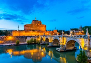 night view of castle sant angelo (mausoleum of hadrian), bridge sant angelo and river tiber in roma. italy.