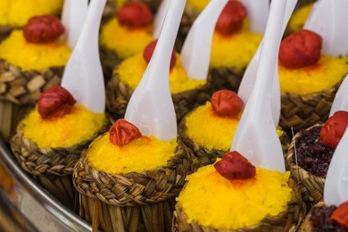 pineapple rice, a tradtional appetizer in yunnan province, southwest china. colorful sticky rice wrapped with leaves
