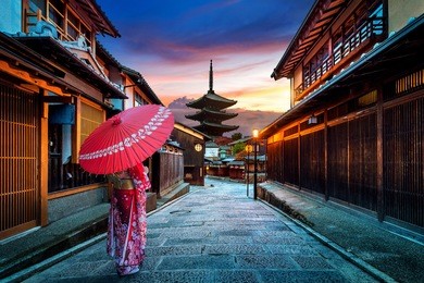 asian woman wearing japanese traditional kimono at yasaka pagoda and sannen zaka street in kyoto, japan.
