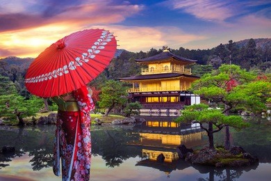 asian woman wearing japanese traditional kimono at golden pavilion. kinkakuji temple in kyoto, japan.