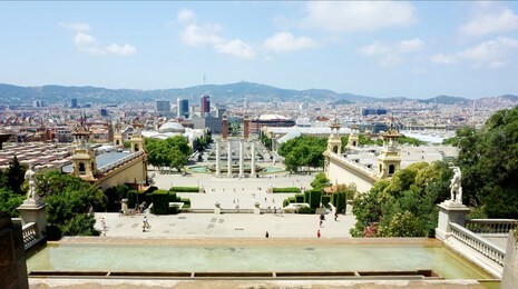view of the fountain and city in barcelona
