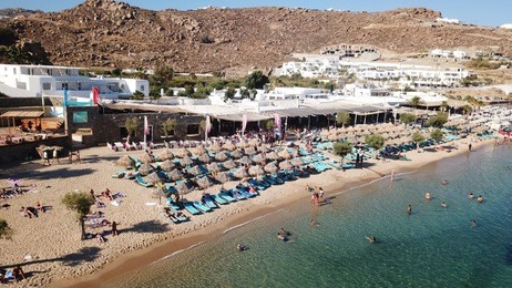 aerial drone photo of famous turquoise and sapphire clear water beach of paradise in popular island of mykonos, cyclades, greece