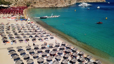 aerial drone, bird's eye view photo of iconic and famous beach of super paradise with sapphire and emerald clear water sea, mykonos island, cyclades, greece