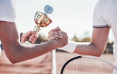 tennis champion. winner of the tournament holding cup in a hand. sport, recreation concept