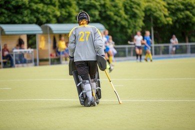 upset field hockey player goalier after defeat in the game