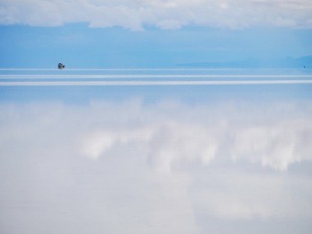 off-road car in the salar de uyuni is largest salt flat in the world unesco world heritage site - altiplano, bolivia