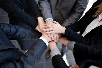team work concept. business people joining hands.