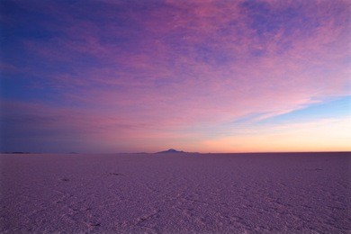 pink sunrise over the salt lake of salar de uyuni, the biggest salt lake in the world and one of the landmark of bolivia