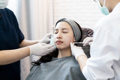 injection for asian female face. plastic aesthetic facial surgery