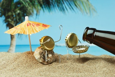 funny cork and bottle on a sandy beach