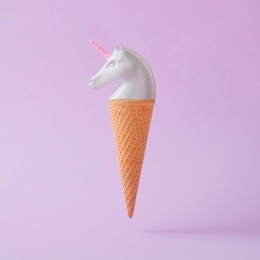 white painted unicorn head ice cream on pastel purple background. minimal art fantasy concept. summer fairytale.