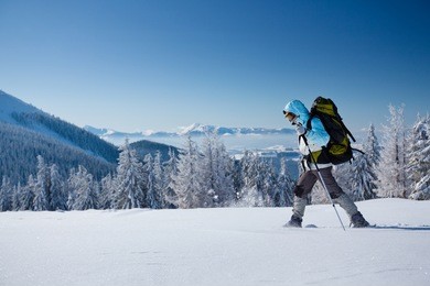 hiker in winter mountains