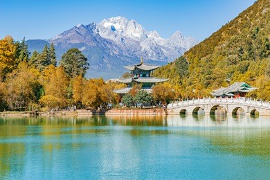 autumn view of the jade dragon snow mountain and the black dragon pool. yunnan province. lijiang. china.