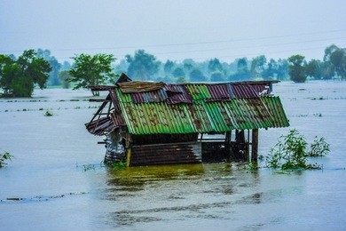 water flowing from highland, mountains flooding, poor houses in rural areas, laos, thailand, burma, cambodia, vietnam, philippines, indonesia southeast asia
