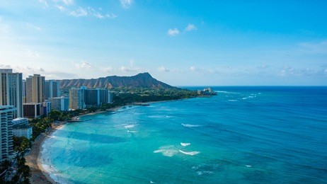 waikiki beach and diamond head crater including the hotels and buildings in waikiki, honolulu, oahu island, hawaii. waikiki beach in the center of honolulu has the largest number of visitors in hawaii