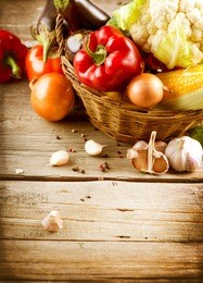 healthy organic vegetables on a wooden background. art border design