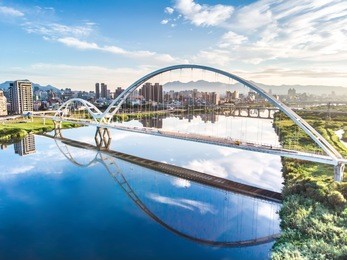 crescent bridge - landmark of new taipei, taiwan with beautiful illumination at day, aerial photography in new taipei, taiwan.