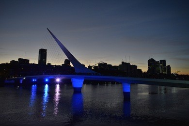 night photo of puerto madero with woman´s bridge, buenos aires, argentina