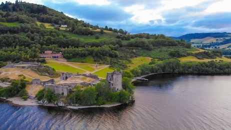 urquhart castle at famous lake loch ness in the evening - aerial view