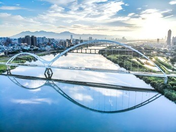 crescent bridge - landmark of new taipei, taiwan with beautiful illumination at day, aerial photography in new taipei, taiwan.