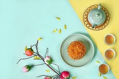 decoration moon cake and tea for mid autumn festival with text space.moon cake with chinese text "kam lun tai egg yolk"