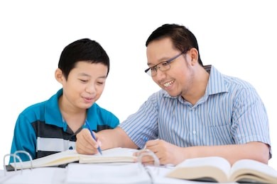 image of young father helping his son doing homework while sitting in the studio, isolated on white background