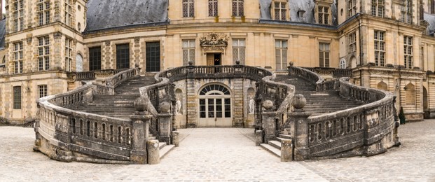 grand stone stairs to an old medieval european castle