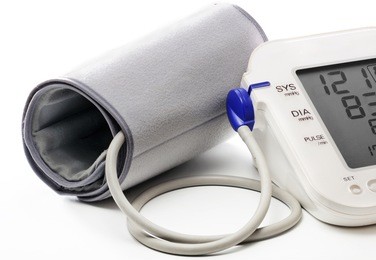 blood pressure meter showing a normal blood pressure (121/83). isolated on white.