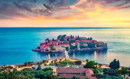 aerial summer cityscape of sveti stefan town. incredible evening seascape of adriatic sea, montenegro, europe. beautiful world of mediterranean countries. architecture traveling background.