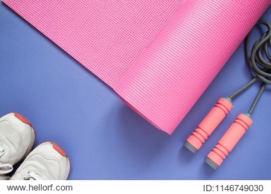 sport and fitness equipments on purple colour background, top view beauty and healthy concept
