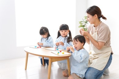 children and teacher at kindergarten