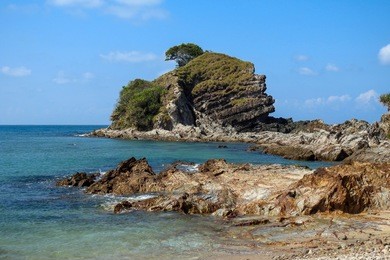  hidden beauty nature of kapas island located in malaysia, magical rock formation over blue sky background. selective focus image at sunny day         