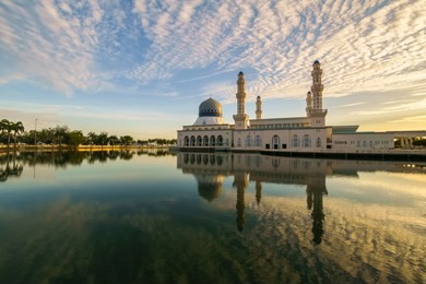 beautiful golden sunrise over the majestic floating kota kinabalu city mosque